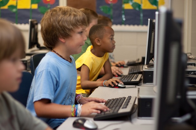 Image of students using computer from https://pixabay.com/en/students-computer-young-boy-99506/